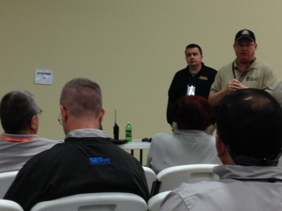 EMAT members attend a mission briefing during JRSOI.